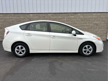 2015 Toyota Prius Three in a Blizzard Pearl exterior color and Misty Grayinterior. Wilmington Auto Center Chrysler Dodge Jeep Ram (937) 556-6430 wilmingtonautocentercdjr.com 