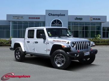 2023 Jeep Gladiator Rubicon 4x4 in a Silver Zynith Clear Coat exterior color and PREM CLOTHinterior. Champion Chrysler Jeep Dodge Ram 800-549-1084 pixelmotiondemo.com 