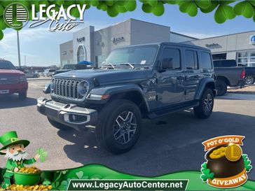 2024 Jeep Wrangler 4-door Sahara in a Anvil Clear Coat exterior color and Blackinterior. Legacy Auto Center 620-315-9264 legacyautocenter.net 