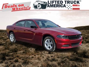 2023 Dodge Charger SXT in a Octane Red Pearl Coat exterior color and Blackinterior. Lifted Truck America 888-267-0644 liftedtruckamerica.com 