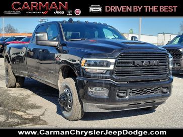 2024 RAM 3500 Laramie Crew Cab 4x4 8' Box in a Diamond Black Crystal Pearl Coat exterior color. Carman Chrysler Jeep Dodge Ram 302-317-2378 carmanchryslerjeepdodge.com 