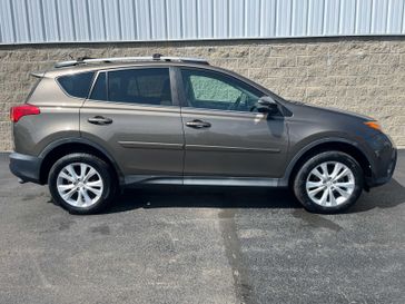 2015 Toyota RAV4 Limited in a Pyrite Mica exterior color and Latteinterior. Wilmington Auto Center Chrysler Dodge Jeep Ram (937) 556-6430 wilmingtonautocentercdjr.com 