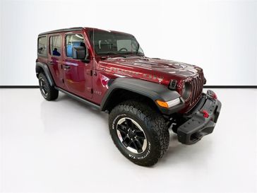 2021 Jeep Wrangler Unlimited Rubicon in a Snazzberry Pearl Coat exterior color and Blackinterior. Sheridan Motors CDJR 307-218-2217 sheridanmotor.com 