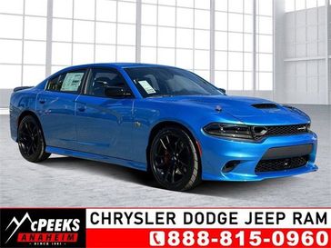 2023 Dodge Charger Super Bee in a B5 Blue exterior color and Carboninterior. McPeek's Chrysler Dodge Jeep Ram of Anaheim 888-861-6929 mcpeeksdodgeanaheim.com 