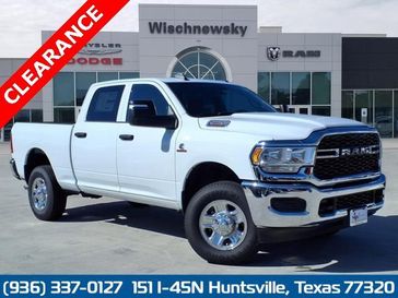 2024 RAM 2500 Tradesman Crew Cab 4x4 6'4' Box in a Bright White Clear Coat exterior color and Blackinterior. Wischnewsky Dodge 936-755-5310 wischnewskydodge.com 