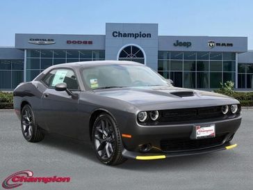 2023 Dodge Challenger Gt in a Granite exterior color and HOUNDSTOOTHinterior. Champion Chrysler Jeep Dodge Ram 800-549-1084 pixelmotiondemo.com 