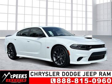 2023 Dodge Charger Scat Pack in a White Knuckle exterior color and Blackinterior. McPeek's Chrysler Dodge Jeep Ram of Anaheim 888-861-6929 mcpeeksdodgeanaheim.com 