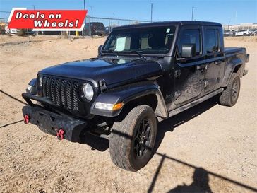 2021 Jeep Gladiator Sport in a Granite Crystal Metallic Clear Coat exterior color and Blackinterior. Melloy Dodge RAM FIAT 505-588-4459 melloydodge.com 