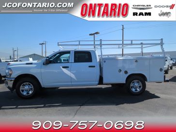 2023 RAM 2500 Tradesman Crew Cab 4x2 8' Box in a Bright White Clear Coat exterior color and Blackinterior. Jeep Chrysler Dodge RAM FIAT of Ontario 909-757-0698 jcofontario.com 