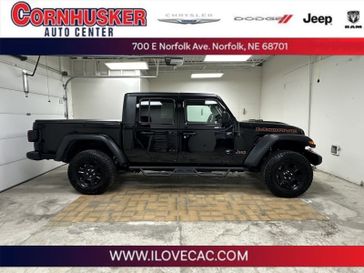 2021 Jeep Gladiator Mojave in a Black Clear Coat exterior color and Blackinterior. Cornhusker Auto Center 402-866-8665 cornhuskerautocenter.com 