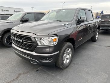 2024 RAM 1500 Big Horn Crew Cab 4x4 5'7' Box in a Granite Crystal Metallic Clear Coat exterior color and Blackinterior. CDJR of Anytown 949-555-4321 pixelmotiondemo.com 