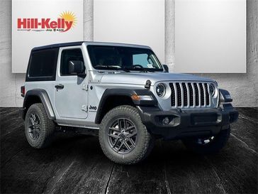 2024 Jeep Wrangler 2-door Sport S in a Silver Zynith Clear Coat exterior color. Hill-Kelly Dodge (850) 786-2130 hillkellydodge.com 
