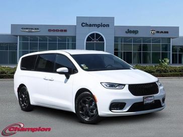 2023 Chrysler Pacifica Plug-in Hybrid Touring L in a Bright White Clear Coat exterior color and CAPRICEinterior. Champion Chrysler Jeep Dodge Ram 800-549-1084 pixelmotiondemo.com 