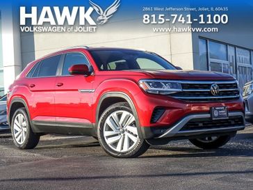 2023 Volkswagen Atlas Cross Sport 3.6L V6 SE w/Technology in a Aurora Red Metallic exterior color and Titan Blackinterior. Glenview Luxury Imports 847-904-1233 glenviewluxuryimports.com 