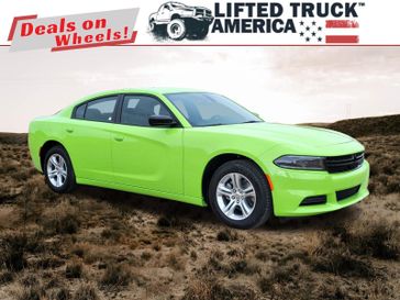 2023 Dodge Charger SXT in a Sublime Metallic Clear Coat exterior color and Blackinterior. Lifted Truck America 888-267-0644 liftedtruckamerica.com 
