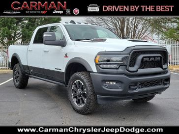 2024 RAM 2500 Rebel Crew Cab 4x4 6'4' Box in a Bright White Clear Coat exterior color and Black - ALX9interior. Carman Chrysler Jeep Dodge Ram 302-317-2378 carmanchryslerjeepdodge.com 