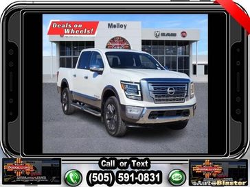 2023 Nissan Titan Platinum Reserve in a Pearl White Metallic exterior color and Black/Browninterior. Melloy Dodge RAM FIAT 505-588-4459 melloydodge.com 