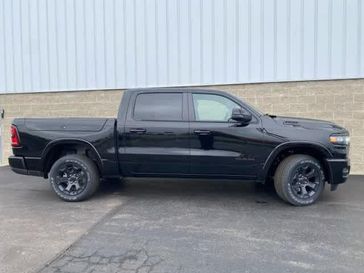 2025 RAM 1500 Big Horn Crew Cab 4x4 5'7' Box in a Diamond Black Crystal Pearl Coat exterior color and Blackinterior. Wilmington Auto Center Chrysler Dodge Jeep Ram (937) 556-6430 wilmingtonautocentercdjr.com 