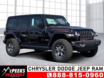 2023 Jeep Wrangler 4-door Rubicon 4x4 in a Black Clear Coat exterior color and Blackinterior. McPeek's Chrysler Dodge Jeep Ram of Anaheim 888-861-6929 mcpeeksdodgeanaheim.com 