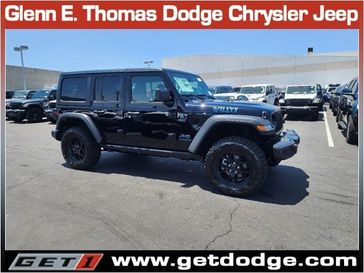 2024 Jeep Wrangler 4-door Willys 4xe in a Black Clear Coat exterior color and Blackinterior. Glenn E Thomas 100 Years Of Excellence (866) 340-5075 getdodge.com 