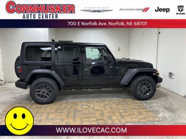 2024 Jeep Wrangler Sport in a Black Clear Coat exterior color and Blackinterior. Cornhusker Auto Center 402-866-8665 cornhuskerautocenter.com 