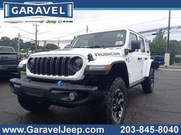 2024 Jeep Wrangler 4-door Rubicon X 4xe in a Bright White Clear Coat exterior color and Blackinterior. Garavel Jeep 475-258-7987 norwalkjeep.com 