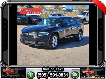 2022 Dodge Charger SXT in a Pitch Black Clear Coat exterior color and Blackinterior. Melloy Dodge RAM FIAT 505-588-4459 melloydodge.com 