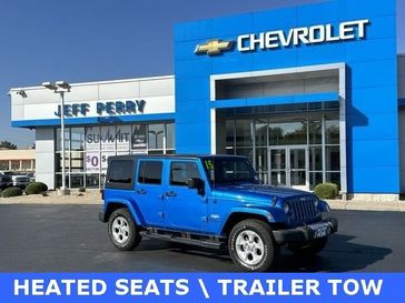 2015 Jeep Wrangler Unlimited Sahara in a Hydro Blue Pearl Coat exterior color and Blackinterior. Jeff Perry Chrysler Jeep 815-859-8394 jeffperrychryslerjeep.com 