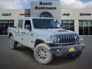 New 2026 Jeep Gladiator Sport S in a Gray exterior color and Blackinterior. Southbay Chrysler Jeep Dodge Ram (424) 404-5521 pixelmotiondemo.com 