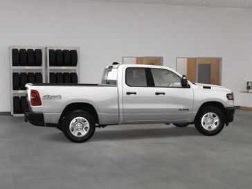 New 2025 RAM 1500 Tradesman Quad Cab 4x4 6'4' Box in a Bright White Clear Coat exterior color. Kamaaina Motors 1-808-746-7956 kamaainamotors.com 