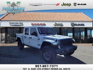 2022 Jeep Gladiator Rubicon 4x4 in a Bright White Clear Coat exterior color and Blackinterior. Perris Valley Chrysler Dodge Jeep Ram 951-355-1970 perrisvalleydodgejeepchrysler.com 