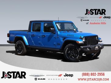 2023 Jeep Gladiator Willys 4x4 in a Hydro Blue Pearl Coat exterior color and Blackinterior. J Star Chrysler Dodge Jeep Ram of Anaheim Hills 888-802-2956 jstarcdjrofanaheimhills.com 