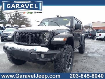 2024 Jeep Wrangler 4-door Rubicon 4xe in a Black Clear Coat exterior color and Blackinterior. Garavel Jeep 475-258-7987 norwalkjeep.com 