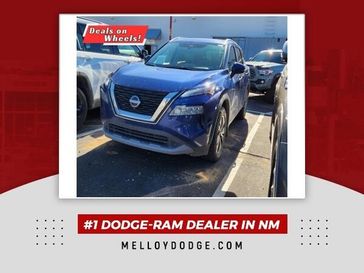 2022 Nissan Rogue SV in a Caspian Blue Metallic exterior color and Grayinterior. Melloy Dodge RAM FIAT 505-588-4459 melloydodge.com 