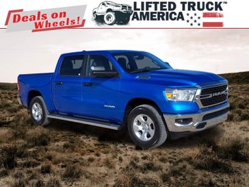 2024 RAM 1500 Big Horn in a Hydro Blue Pearl Coat exterior color and Diesel Gray/Blackinterior. Lifted Truck America 888-267-0644 liftedtruckamerica.com 