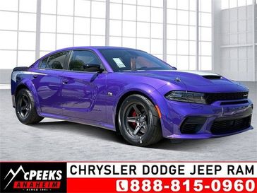 2023 Dodge Charger Super Bee in a Plum Crazy exterior color and Carboninterior. McPeek's Chrysler Dodge Jeep Ram of Anaheim 888-861-6929 mcpeeksdodgeanaheim.com 
