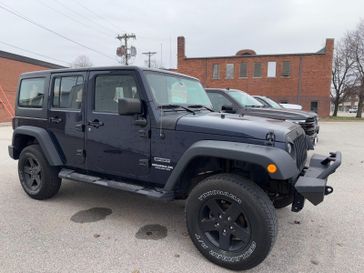 2013 Jeep Wrangler Unlimited Sport in a True Blue Pearl Coat exterior color. Hometown Motors of Rockwell City 712-220-7644 hometownmotorsrc.com 