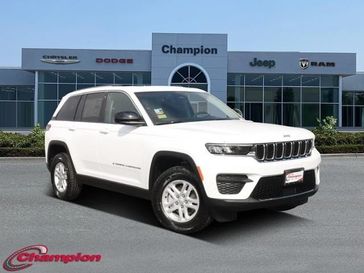 2023 Jeep Grand Cherokee Laredo 4x2 in a Bright White Clear Coat exterior color and CLOTHinterior. Champion Chrysler Jeep Dodge Ram 800-549-1084 pixelmotiondemo.com 