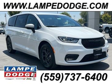 2023 Chrysler Pacifica Plug-in Hybrid Limited in a Bright White Clear Coat exterior color and Blackinterior. Lampe Chrysler Dodge Jeep RAM 559-471-3085 pixelmotiondemo.com 