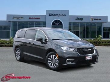 2023 Chrysler Pacifica Plug-in Hybrid Touring L in a Brilliant Black Crystal Pearl Coat exterior color and CAPRICE LTHRinterior. Champion Chrysler Jeep Dodge Ram 800-549-1084 pixelmotiondemo.com 