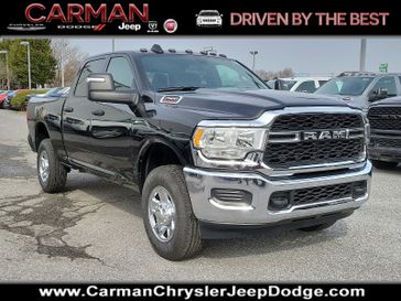 2024 RAM 2500 Tradesman Crew Cab 4x4 6'4' Box in a Diamond Black Crystal Pearl Coat exterior color. Carman Chrysler Jeep Dodge Ram 302-317-2378 carmanchryslerjeepdodge.com 