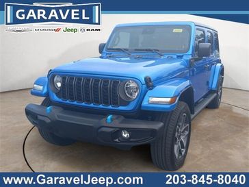 2024 Jeep Wrangler 4-door Sport S 4xe in a Hydro Blue Pearl Coat exterior color and Blackinterior. Garavel Jeep 475-258-7987 norwalkjeep.com 