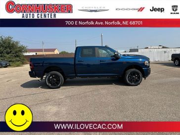 2024 RAM 2500 Laramie Crew Cab 4x4 6'4' Box in a Patriot Blue Pearl Coat exterior color and Blackinterior. Cornhusker Auto Center 402-866-8665 cornhuskerautocenter.com 