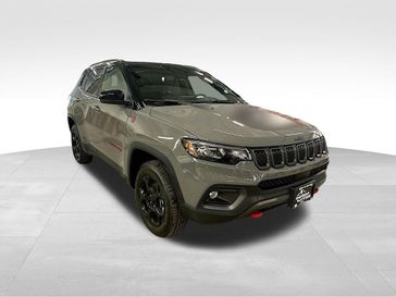 2023 Jeep Compass Trailhawk 4x4 in a Sting-Gray Clear Coat exterior color and Ruby Red/Blackinterior. Sheridan Motors CDJR 307-218-2217 sheridanmotor.com 