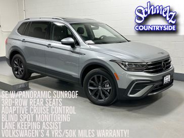 2023 Volkswagen Tiguan SE w/Sunroof & 3rd Row in a Pyrite Silver Metallic exterior color and Black Heated Seatsinterior. Schmelz Countryside Alfa Romeo (651) 867-3222 schmelzalfaromeo.com 