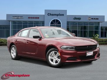 2023 Dodge Charger SXT Rwd in a Octane Red exterior color and HOUNDSTOOTHinterior. Champion Chrysler Jeep Dodge Ram 800-549-1084 pixelmotiondemo.com 