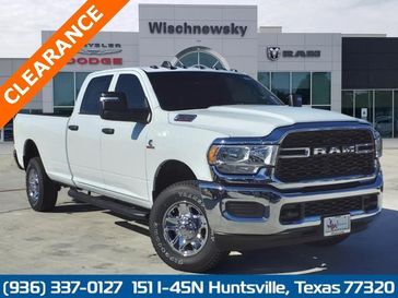 2024 RAM 2500 Tradesman Crew Cab 4x4 8' Box in a Bright White Clear Coat exterior color and Blackinterior. Wischnewsky Dodge 936-755-5310 wischnewskydodge.com 