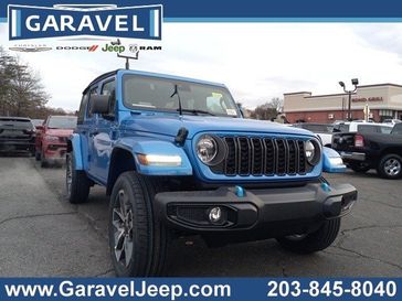 2024 Jeep Wrangler 4-door Sport S 4xe in a Hydro Blue Pearl Coat exterior color and Blackinterior. Garavel Jeep 475-258-7987 norwalkjeep.com 