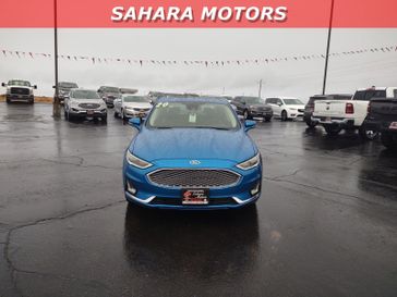 2020 Ford Fusion Titanium in a Blue exterior color. Sahara Motors Inc 435-500-5052 saharamotorschryslerdodgejeep.com 