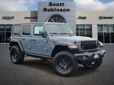 New 2024 Jeep Wrangler 4xE Willys 4xe in a Gray exterior color and Blackinterior. Southbay Chrysler Jeep Dodge Ram (424) 404-5521 pixelmotiondemo.com 